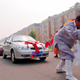Illustration for article titled Chinese Woman Pulls Six Cars With Her Hair